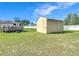 Well-maintained backyard features a shed and an above ground pool at 1034 Shadowbrook N Dr, Lakeland, FL 33813