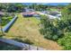 Spacious yard featuring a home, above ground pool, shed, and beautiful green trees at 1034 Shadowbrook N Dr, Lakeland, FL 33813