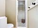 Bathroom featuring a glass shower stall with a wooden stool inside and black towel hooks at 1034 Shadowbrook N Dr, Lakeland, FL 33813