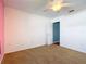 Bedroom featuring carpeted floors, a ceiling fan, and a white door to another room at 1034 Shadowbrook N Dr, Lakeland, FL 33813