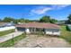 Inviting single-story home featuring a tidy front yard, and a neutral color scheme at 1034 Shadowbrook N Dr, Lakeland, FL 33813