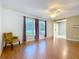 Light-filled living area featuring hardwood floors, bright lighting and comfortable armchair at 1034 Shadowbrook N Dr, Lakeland, FL 33813