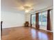 Bright living room with hardwood floors, natural light, and comfortable seating at 1034 Shadowbrook N Dr, Lakeland, FL 33813