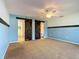 Light and bright main bedroom featuring a ceiling fan and decorative accent wall at 1034 Shadowbrook N Dr, Lakeland, FL 33813