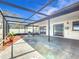 The screened patio features ample space for outdoor seating and dining at 1034 Shadowbrook N Dr, Lakeland, FL 33813