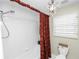 Unique bathroom with decorative shower curtain and chandelier at 1117 Stonebrooke Ln # 58, Lakeland, FL 33803