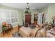 Bedroom with shutters, ceiling fan, hardwood floors, and ensuite bath access at 1117 Stonebrooke Ln # 58, Lakeland, FL 33803