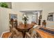 Charming dining area with a round wooden table and decorative chairs at 1117 Stonebrooke Ln # 58, Lakeland, FL 33803