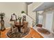 Cozy dining area featuring a round table, decorative rug, and staircase access at 1117 Stonebrooke Ln # 58, Lakeland, FL 33803