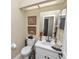 Cozy half bathroom with a vanity, toilet, and decorative accents at 1117 Stonebrooke Ln # 58, Lakeland, FL 33803