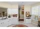 Bright kitchen features white cabinets, neutral countertops, and modern appliances at 1117 Stonebrooke Ln # 58, Lakeland, FL 33803