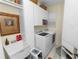 Well-organized laundry room with washer, dryer, and ample storage space at 1117 Stonebrooke Ln # 58, Lakeland, FL 33803
