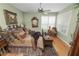 Comfortable main bedroom with a ceiling fan, window shutters, and decorative accents at 1117 Stonebrooke Ln # 58, Lakeland, FL 33803