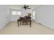 Office space featuring shutters, carpeting, and ceiling fan at 1117 Stonebrooke Ln # 58, Lakeland, FL 33803
