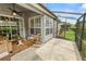 Relaxing screened-in patio with sliding glass doors and comfortable seating at 1117 Stonebrooke Ln # 58, Lakeland, FL 33803