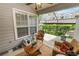 Inviting screened patio with wicker rocking chair and views of the landscape at 1117 Stonebrooke Ln # 58, Lakeland, FL 33803