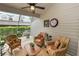 Cozy screened patio with comfortable wicker furniture at 1117 Stonebrooke Ln # 58, Lakeland, FL 33803