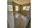 Bedroom with flooring and natural light through two windows at 1120 Ivy Ln, Bartow, FL 33830