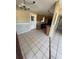 The kitchen features wooden cabinets, tile floors, and standard appliances at 1120 Ivy Ln, Bartow, FL 33830