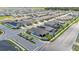 Wide aerial view of a residential area featuring well-maintained lawns, nearby roadways, and attractive landscaping at 1125 Mattie Pointe Blvd, Auburndale, FL 33823