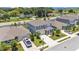 Aerial view showcasing a two-story home with a manicured lawn and a two-car garage at 1125 Mattie Pointe Blvd, Auburndale, FL 33823