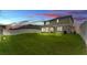 Inviting backyard featuring a screened-in patio and a well-maintained lawn surrounded by a privacy fence at 1125 Mattie Pointe Blvd, Auburndale, FL 33823