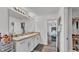 Bright bathroom features double sinks, ample counter space, and easy access to both the closet and the bedroom at 1125 Mattie Pointe Blvd, Auburndale, FL 33823