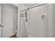 Modern bathroom featuring a tiled shower, glass door, and sleek fixtures for a clean and contemporary look at 1125 Mattie Pointe Blvd, Auburndale, FL 33823