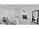 Tranquil bedroom with soft hues, closet and mirror offering a serene space for relaxation and rest at 1125 Mattie Pointe Blvd, Auburndale, FL 33823