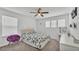 Cozy bedroom with a ceiling fan, natural light, and calming neutral tones at 1125 Mattie Pointe Blvd, Auburndale, FL 33823
