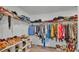 Spacious walk-in closet with ample storage space and organized shelving for all your wardrobe needs at 1125 Mattie Pointe Blvd, Auburndale, FL 33823