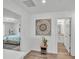 Inviting entryway featuring wood floors, modern decor, and seamless access to the bedroom and bathroom at 1125 Mattie Pointe Blvd, Auburndale, FL 33823