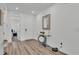 Bright foyer with modern accents, and wood floors at 1125 Mattie Pointe Blvd, Auburndale, FL 33823