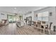 Open-concept kitchen with island, stainless appliances, and dining area at 1125 Mattie Pointe Blvd, Auburndale, FL 33823