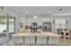 Spacious open kitchen with white cabinets, stainless appliances, and a large quartz countertop island at 1125 Mattie Pointe Blvd, Auburndale, FL 33823