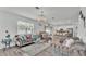 Bright living room with chandelier, open to kitchen and dining areas at 1125 Mattie Pointe Blvd, Auburndale, FL 33823