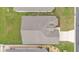 Birds-eye view of the roof and backyard; the home has a well-maintained exterior and surrounding green space at 1129 Bowline St, Winter Haven, FL 33880