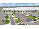 Aerial view of homes in a lakeside neighborhood; some have solar panels and well-maintained lawns at 1129 Bowline St, Winter Haven, FL 33880