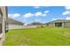 Expansive backyard with lush green grass, privacy fence, and ample space for outdoor activities and relaxation at 1129 Bowline St, Winter Haven, FL 33880