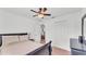 Bright bedroom with a ceiling fan, closet, neutral walls, and comfortable bed, providing a peaceful retreat at 1129 Bowline St, Winter Haven, FL 33880