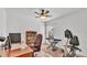 Home office or bedroom space featuring a desk, computer, ceiling fan, and exercise equipment at 1129 Bowline St, Winter Haven, FL 33880