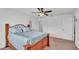Bedroom featuring wood frame bed, ceiling fan, and natural light from the window at 1129 Bowline St, Winter Haven, FL 33880