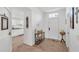 Inviting foyer featuring a decorative table, neutral colors, and tile flooring at 1129 Bowline St, Winter Haven, FL 33880
