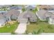 Aerial shot of the home showcasing the landscaped front yard and an attached two-car garage at 1129 Bowline St, Winter Haven, FL 33880