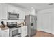 Kitchen featuring stainless steel appliances, white cabinets, and stylish countertops at 1129 Bowline St, Winter Haven, FL 33880