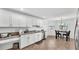 Bright kitchen featuring white cabinets, stainless steel appliances, and a breakfast nook at 1129 Bowline St, Winter Haven, FL 33880