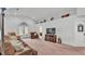 Large living room features carpeted floors, backyard access, and modern decor at 1129 Bowline St, Winter Haven, FL 33880