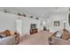 Comfortable living room with neutral colors, carpeted floors, and a stylish decor at 1129 Bowline St, Winter Haven, FL 33880