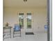 Patio area with outdoor furniture and ADT security sign at 1129 Bowline St, Winter Haven, FL 33880