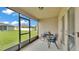 Cozy screened-in patio with comfortable seating and an outside view at 1129 Bowline St, Winter Haven, FL 33880